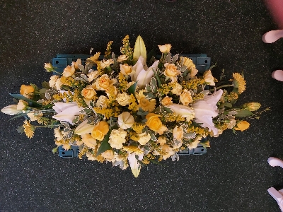 lemon & yellow and white casket spray