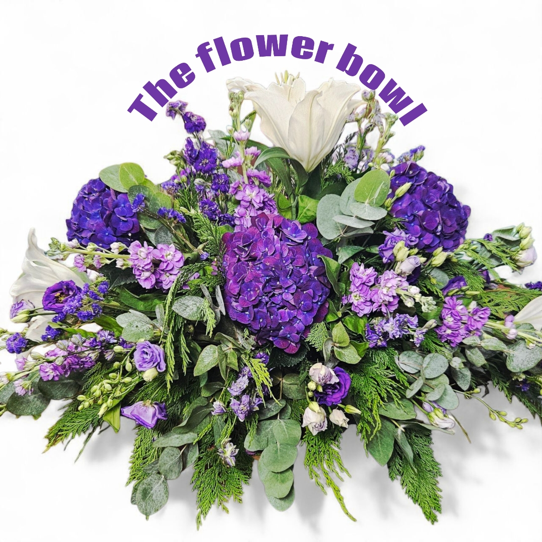 Purple and white casket spray