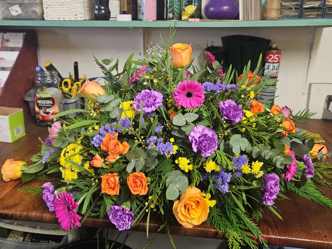 Vibrant casket spray