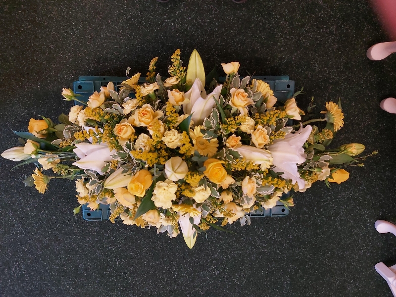 lemon & yellow and white casket spray