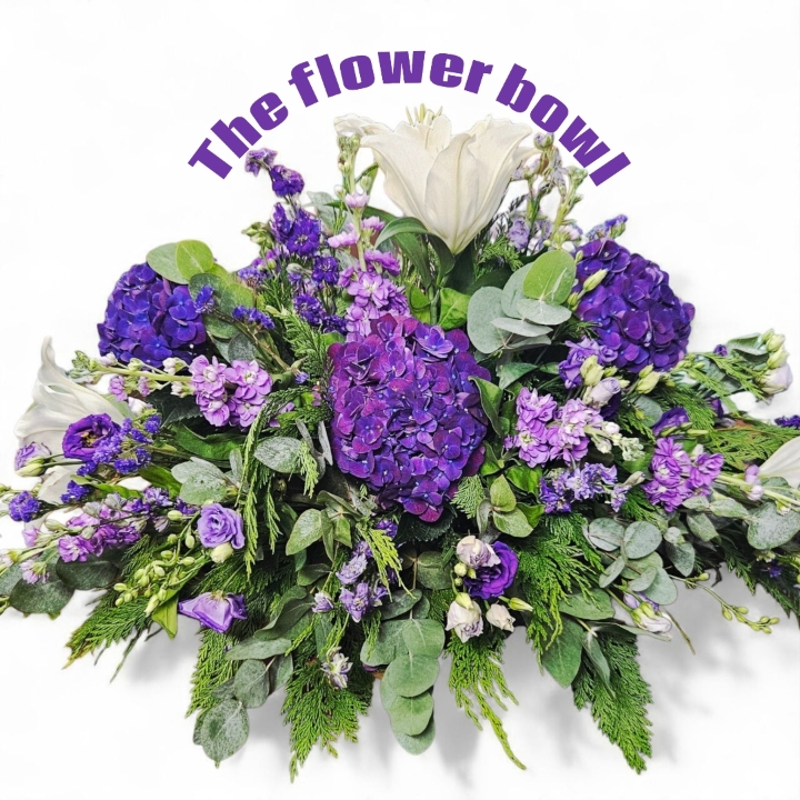 Purple and white casket spray